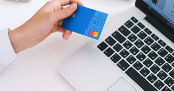 Online Electronics Shopping - Person Holding Bank Card