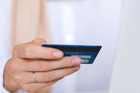Online Shopping - Woman Holding Bank Card